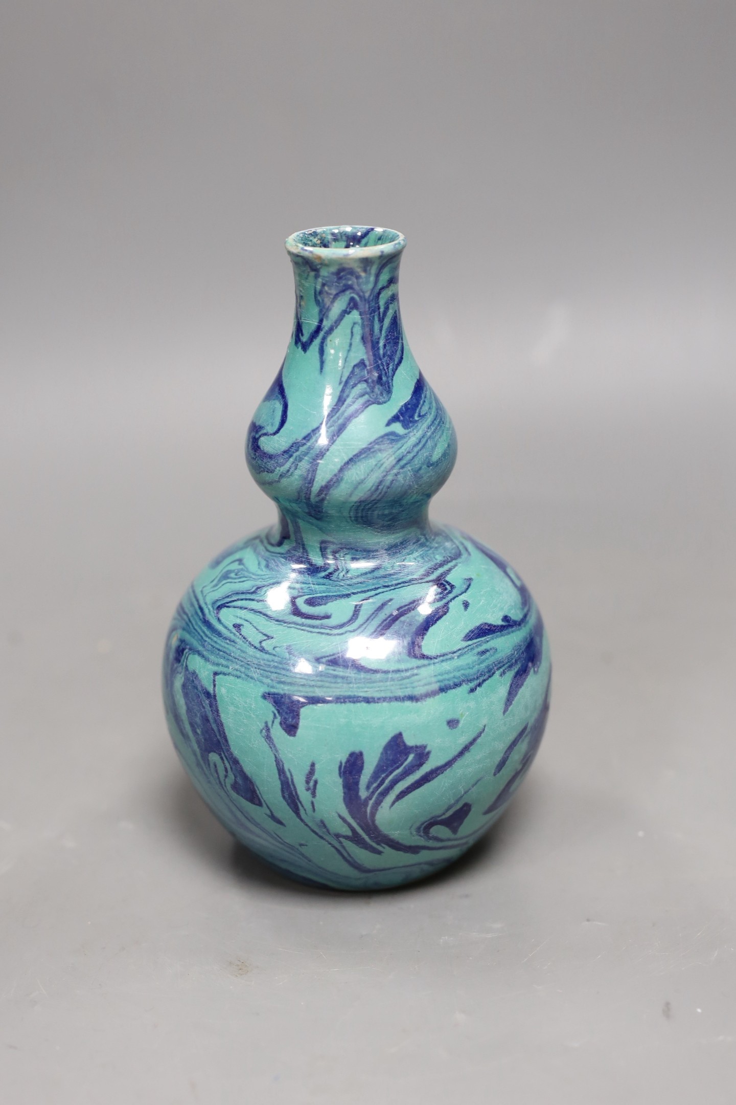 A Chinese double-gourd vase, 17cms